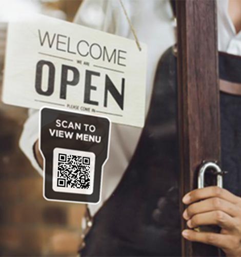 QR code displayed on restaurant window entrance